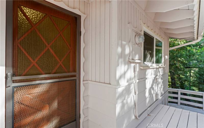 A sheltered entryway, the perfect spot for your cozy chair and a refreshing beverage!