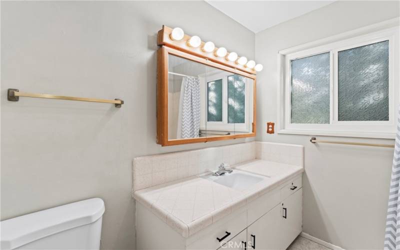 Guest bathroom on the main floor is fully equipped with a tub/shower.