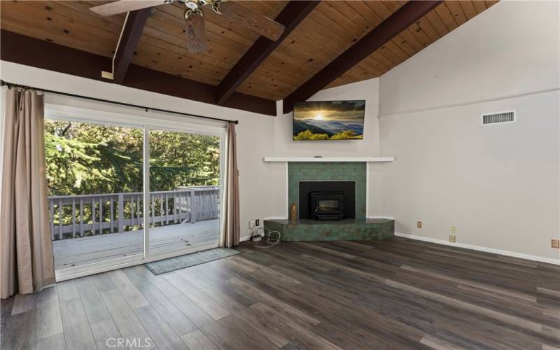 A living room featuring a vintage fireplace upgraded with a new, high-efficiency insert.