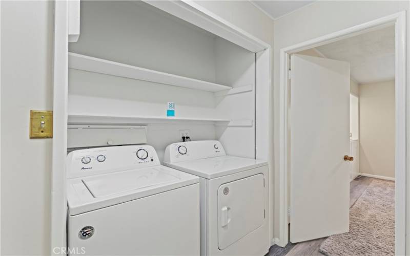 Laundry area includes nearly new washer/dryer