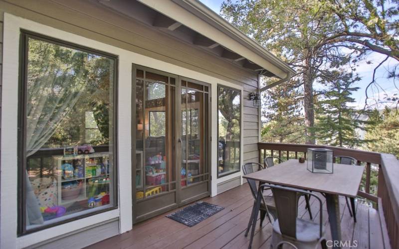 Living room has double doors that open to deck area. Great for entertaining