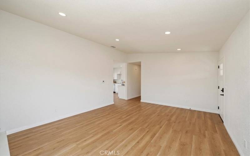 Living Room with recessed lighting and fireplace. Perfect setting for a dining table.