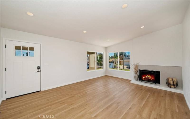 The living rooms pitched ceiling provides a bright and welcoming environment.