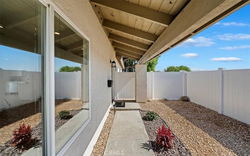 Covered porch way and alcove at entry.