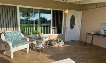 Beachy patio with a view welcomes you