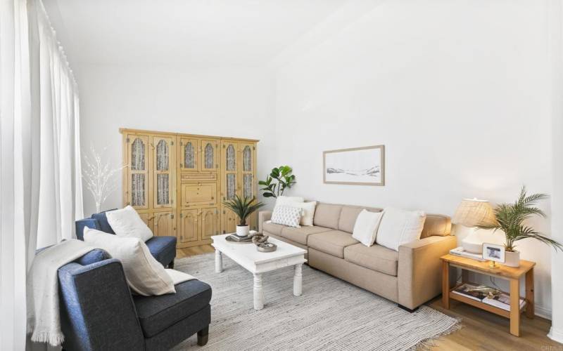 Light and bright living room with vaulted ceilings.