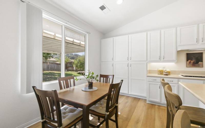 Enjoy meals next to the kitchen with views of the backyard and patio