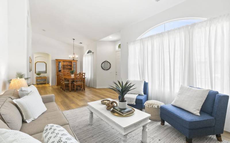 Vaulted ceilings in this open concept Living Room and Dining Room