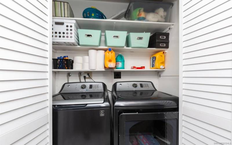 California laundry closet, full size washer and dryer included with shelves for storage