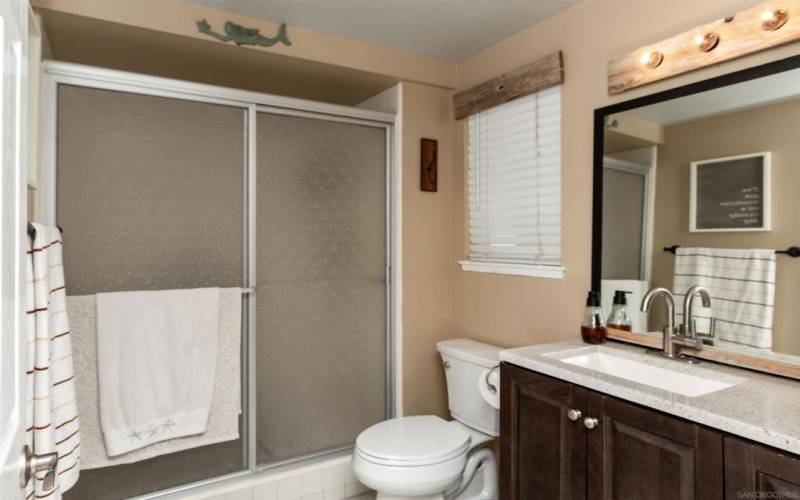 2nd bathroom at end of hall, each bedroom located on opposite sides of home for privacy, with slider onto the patio