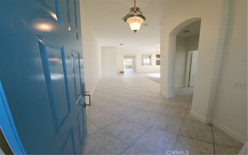 Front entry with look into Living Room and Dining Room. All windows throughout house are covered by Plantation Shutters.