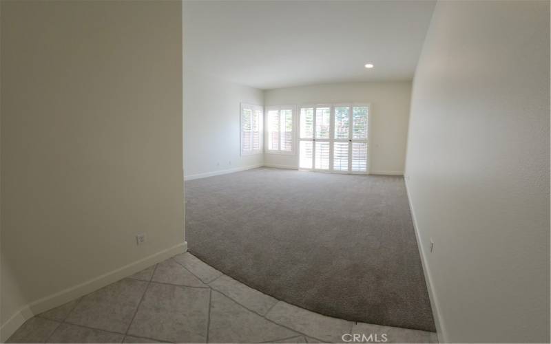 Master bedroom has newly installed carpet and direct access to backyard.