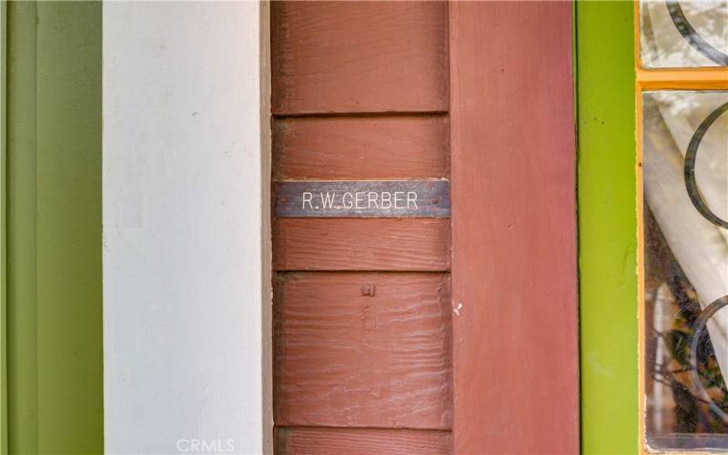 Original name plaque of Dr. Gerber mounted to the right of the front door.