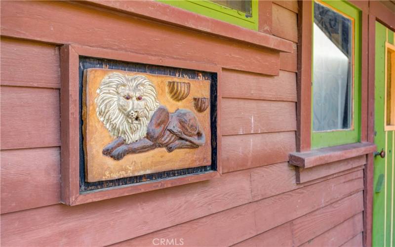 Unique artwork displayed on the exterior of the master bedroom.