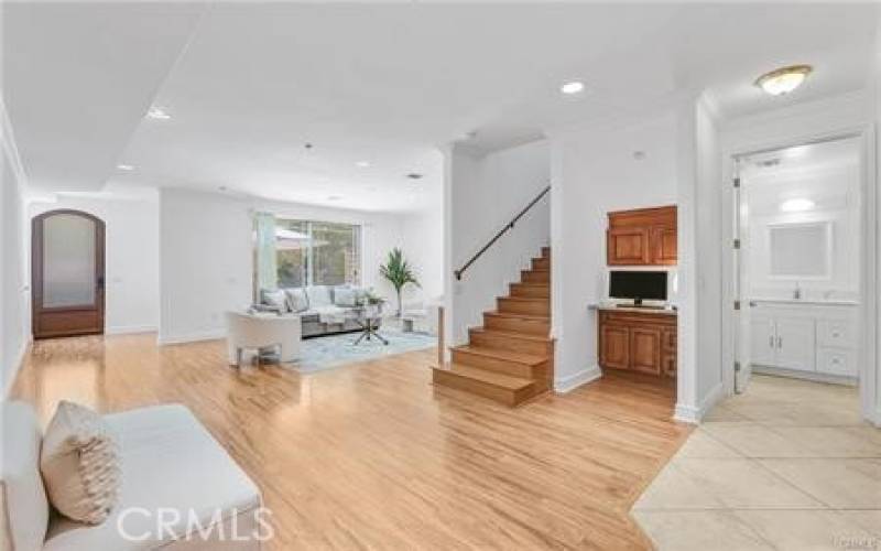 Living room with high ceiling & fireplace opens to the patio - perfect indoor / outdoor entertaining