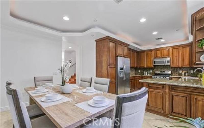 Formal dining room opens to breakfast bar & kitchen