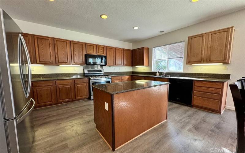 Kitchen with stainless steel stove & refrigerator