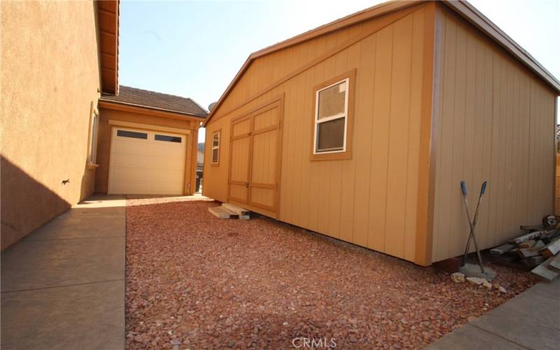 large storage shed near drive thru garage door