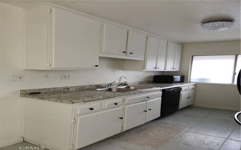 Clean kitchen with appliances.