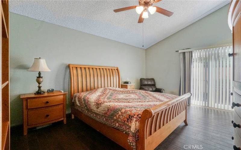 Primary Bedroom w/ Sliding Glass Door  to side Yard