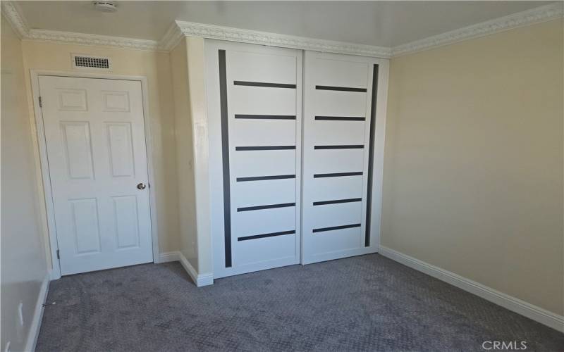 Bed 3 newer carpet and ornate closet doors