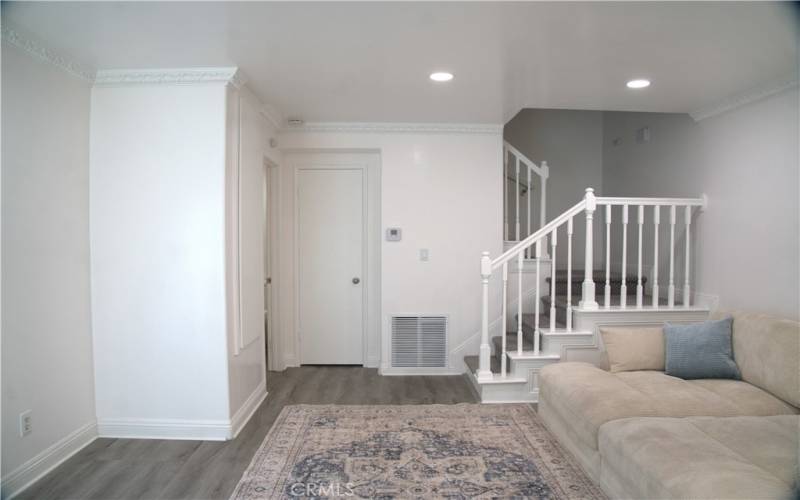 Living Room with updated lighting, wood flooring, paint