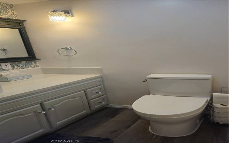 half Bath with newer toilet and flooring