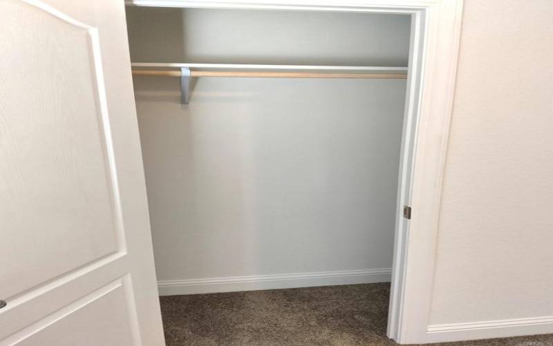 closets with solid shelf and bar