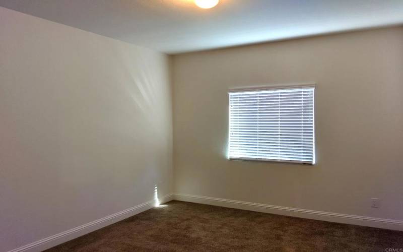 Secondary bedroom with large window