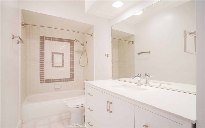 Main bathroom with tub/shower combo located near bedroom 1