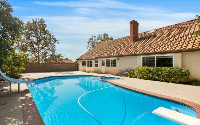 The diving board and slide add to the fun.