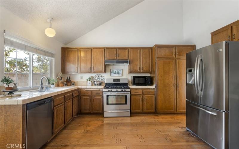 Plenty of cupboard space in this spacious kitchen with vaulted ceilings.