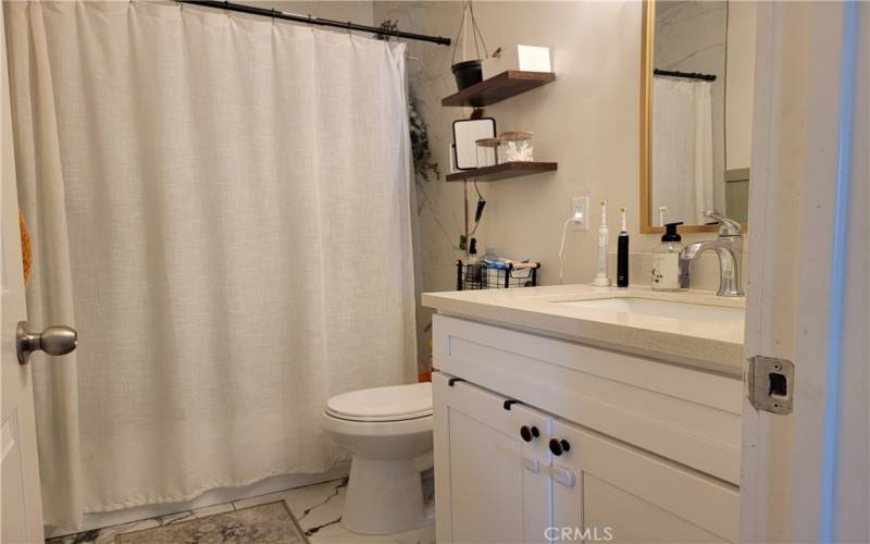 Newer remodeled bathroom-quartz counters & beautiful shower/tub