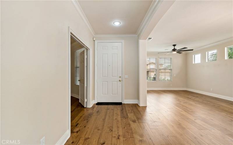 Entering into the foyer, with a large open formal living space, and office/4th bedroom.