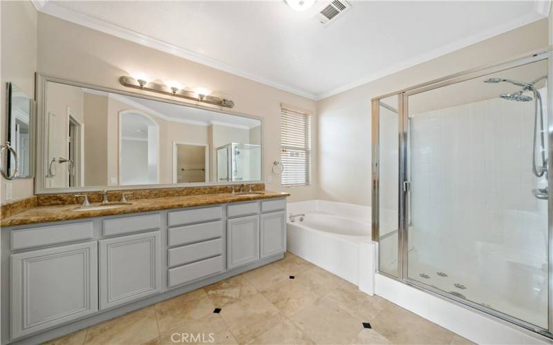 Dual sinks and a separate shower and soaking tub.