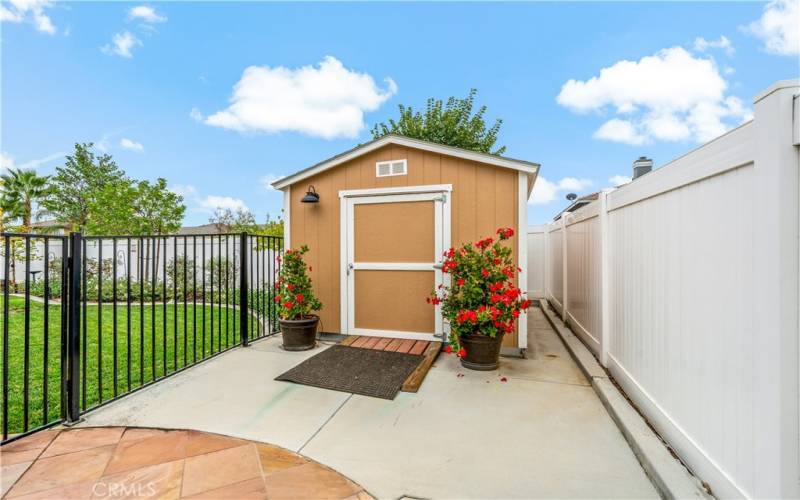 Separately fenced area with a large shed.