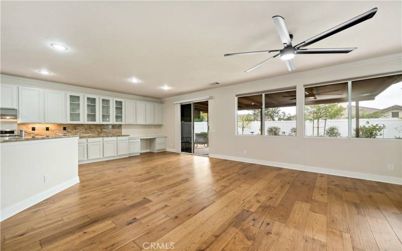 Open concept with the family room kitchen and breakfast nook, connecting to the backyard and covered patio.