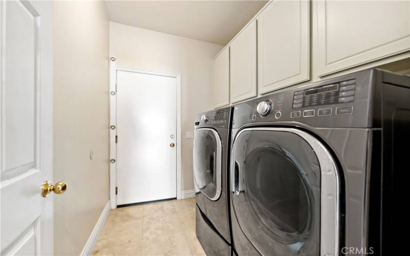 Laundry room connecting to the 3 car garage.