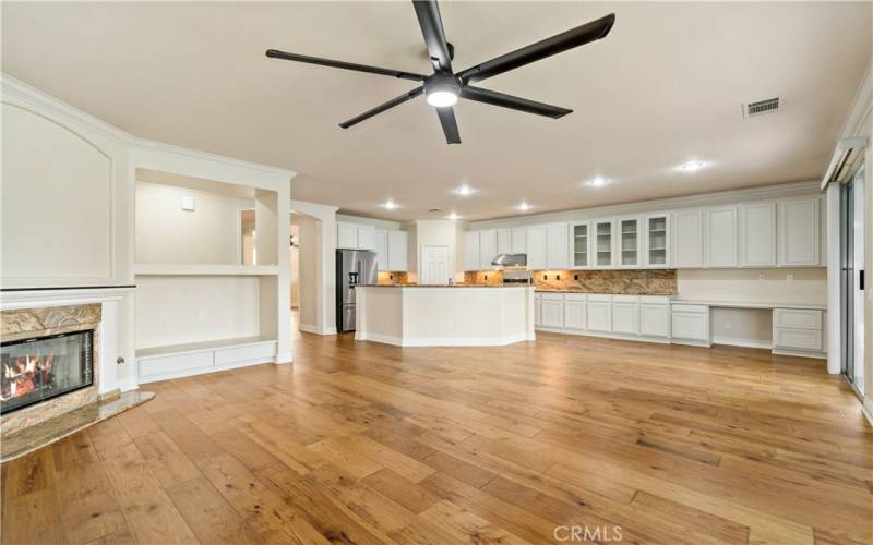 Large family room with oversized ceiling fan.