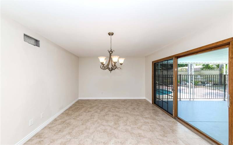 great room leads to enclosed outdoor patio area