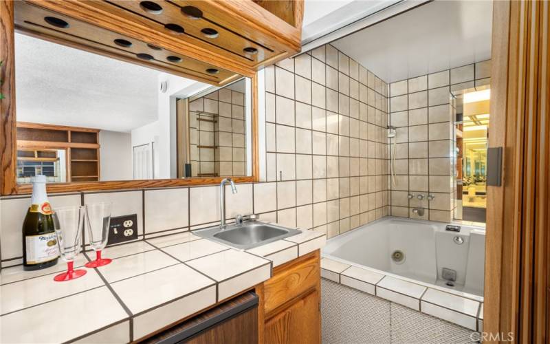 Bar area at end of Primary Bedroom opens to spa