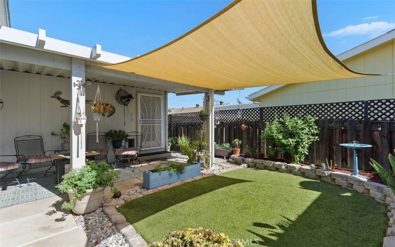 Lush gardens and artificial turf.