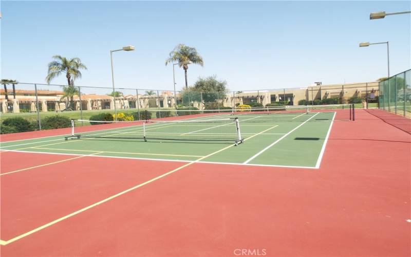 Night lighted tennis court convertible to pickleball courts.