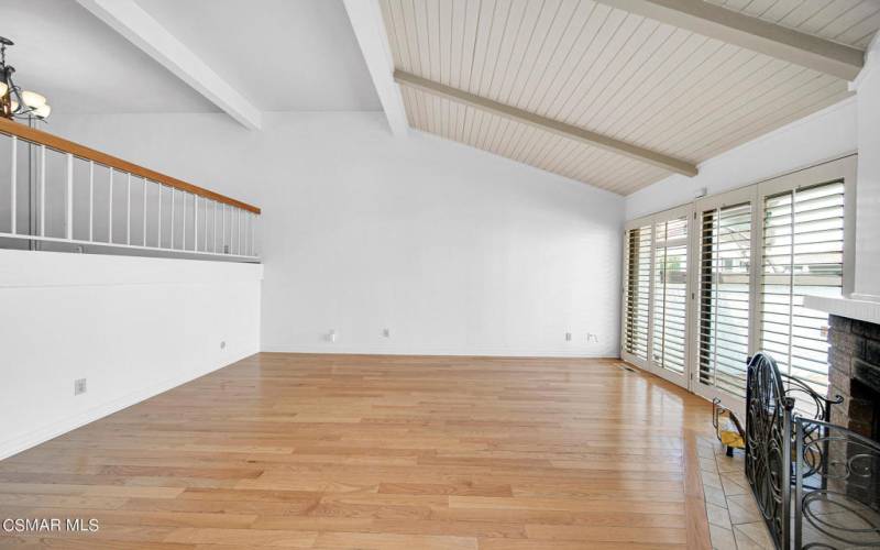 Living room with upper dining area