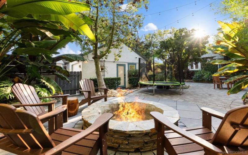 Large built in fire pit and seating area for entertaining.