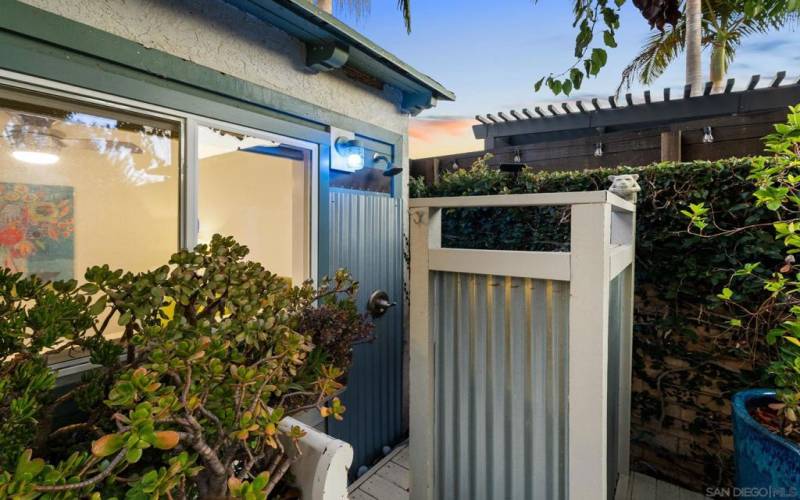 Outdoor shower for rinsing off after beach days, also great for washing furry friends!