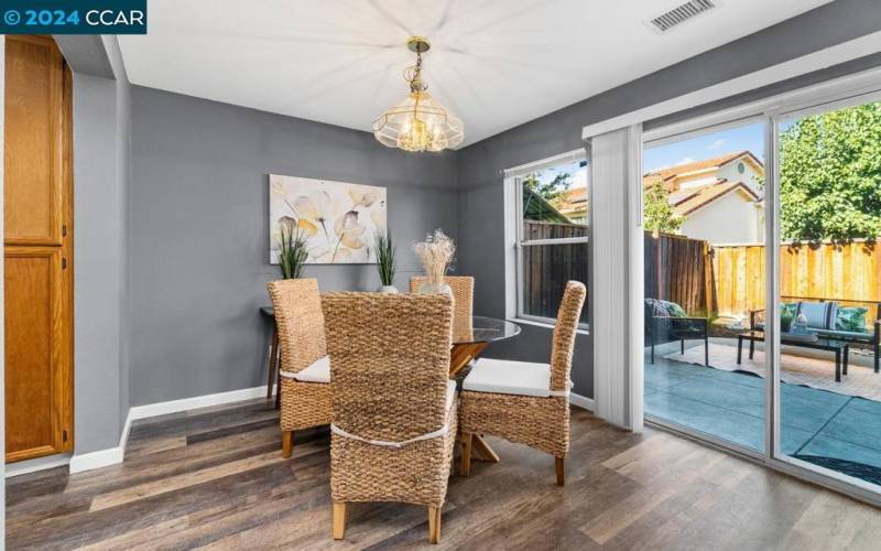 Dining area with view of backyard.