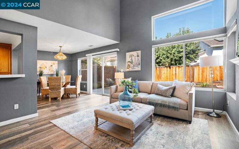 Living Room with view of backyard and dining area.