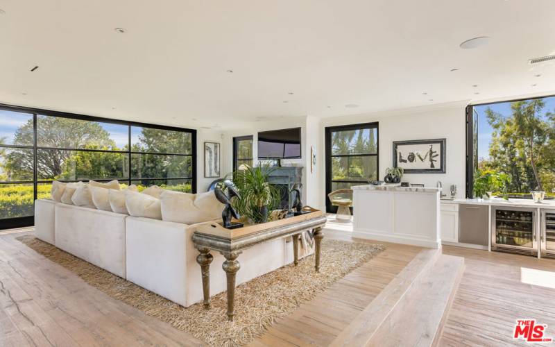 Family room off kitchen with views, fireplace and wet bar.