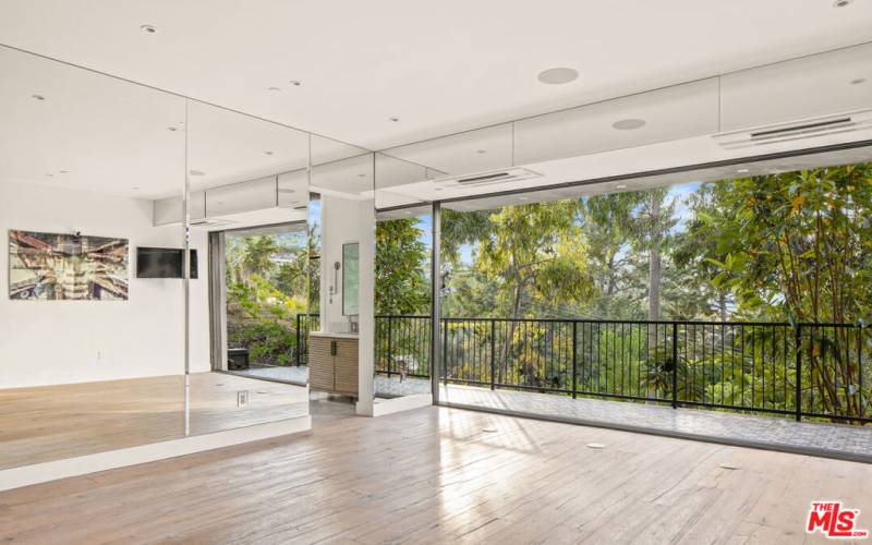 Work out/fitness/meditation room with serene lush greenery